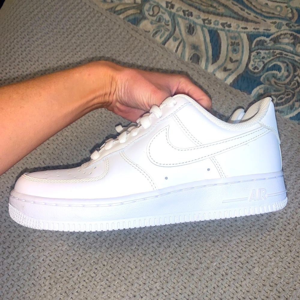 White Nike Air Force ones.